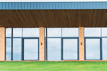 A fragment of a newly built private luxury house outside the city with sliding doors and wooden wallsの写真素材
