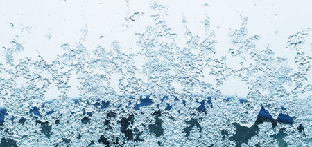 Frozen window in the cold of the beginning of winter