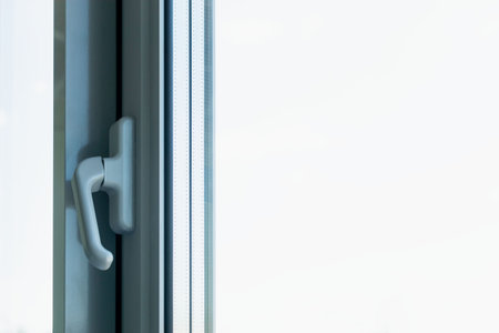 Aluminum windows with handles in a newly built houseの写真素材