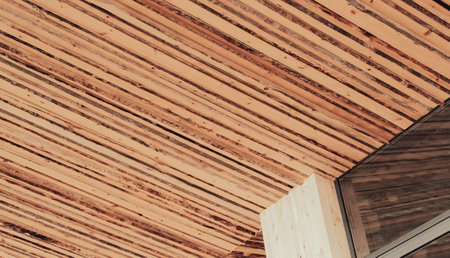 A fragment of a newly built private luxury house outside the city with sliding doors and wooden wallsの写真素材