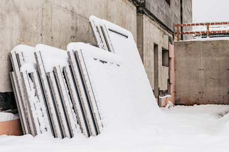 Plastic windows, covered with snow, stand in a pyramidの写真素材