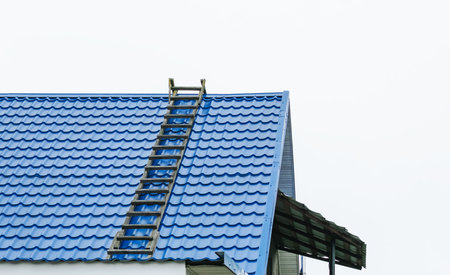 A fragment of the roof of a building with a wooden staircaseの写真素材