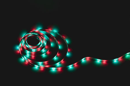 LED strip with multicolored diodes on a dark backgroundの写真素材