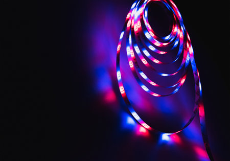 LED strip with multicolored diodes on a dark backgroundの写真素材