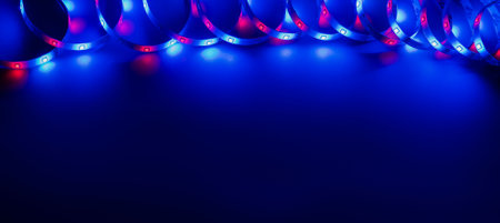 LED strip with multicolored diodes on a dark backgroundの写真素材