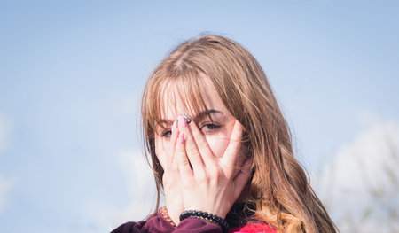 Portrait of a young girl in the garden on a sunny spring day