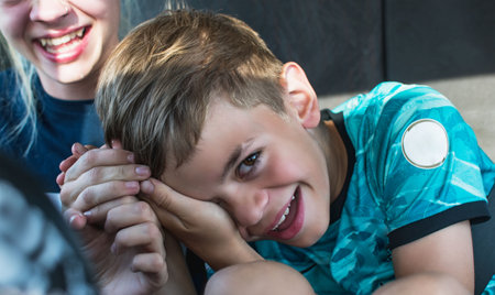 Children frolic and laugh in the car while drivingの写真素材