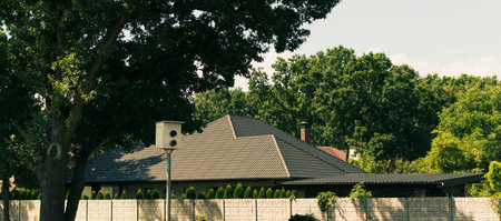 Fragment of a private house outside the city, with green vegetation