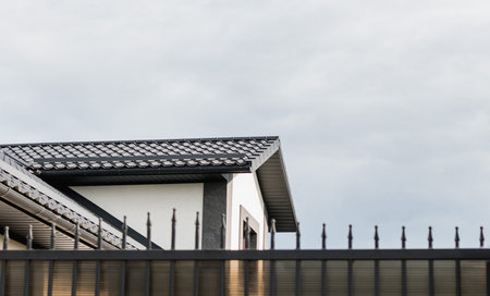 Fragment of a private one-story residential building with a new roof