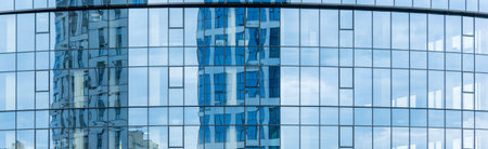 Fragment of the glass facade of a new business center in the city