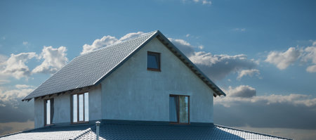A fragment of a new private house with a roof on a sunny dayの写真素材