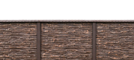 Textural image of a new fence on the background of the roof of a private house
