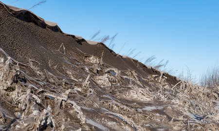 Thick snow on the side of the road, covered with mudの写真素材