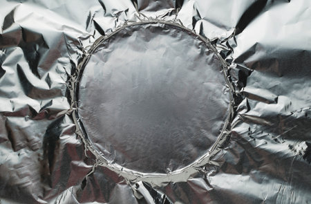 Textured appearance of a thin silver-colored metal foilの写真素材