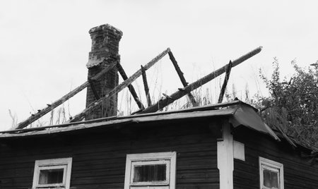 A fragment of a wooden house burned down during a fireの写真素材