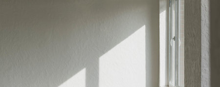 Sunlight falls through a window opening in a new room