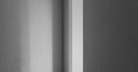 Sunlight falls through a doorway in a new roomの写真素材