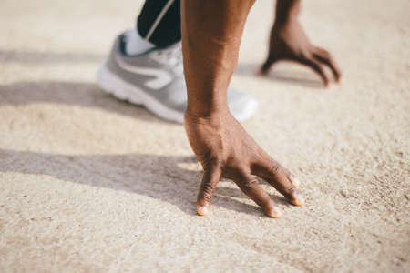 one young african muscular build man on starting poseの写真素材