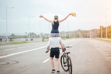 Couple riding their bikes in their free time and having fun on a sunny autumn day.