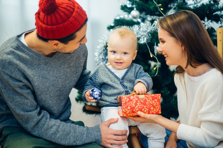 Portrait of friendly family looking at camera on Christmas evening