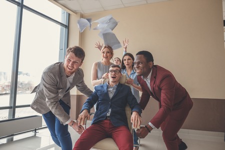 We are the winners. business people having fun while racing on office chairsの写真素材