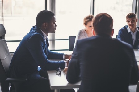 Boss heading a business reunion with partnersの写真素材