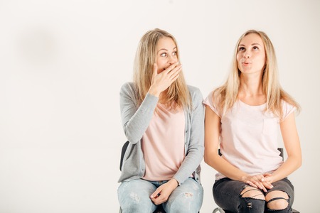 photo of two beautiful young girls . Beauty portrait of twins sistersの写真素材