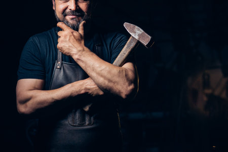 blacksmith portrait with beard in workshop