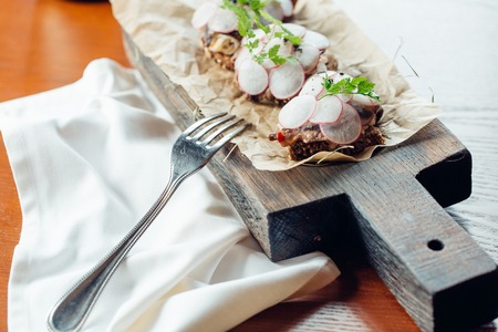 Sandwiches with boar ham, radish, sprouts, and rye breadの写真素材