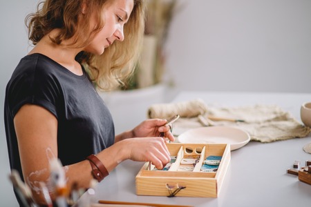 Clay bowl author decorating, pottery makingの写真素材
