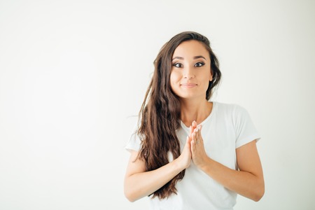 woman holding hands at her face anticipationの写真素材