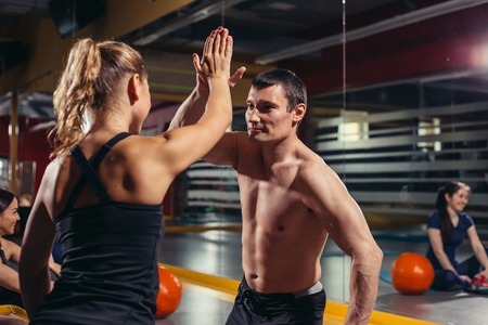 Hands together - fitness team training - high fiveの写真素材