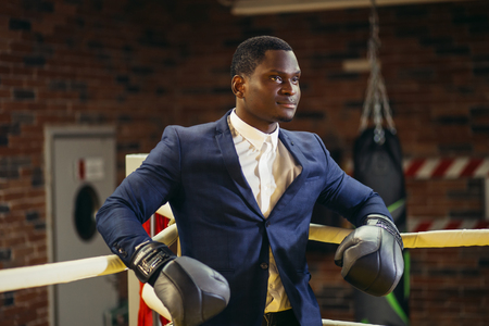 African businessman standing posture in boxing glovesの写真素材