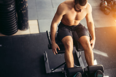 man doing sit ups on bench, working on abdominal muscles