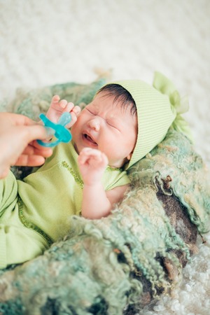 crying newborn two weeks babyの写真素材