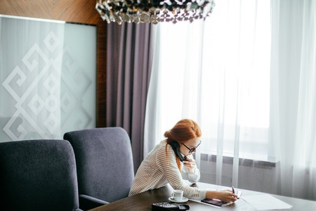 Businesswoman working in officeの写真素材