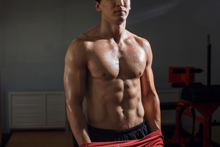 Man with muscular torso showing six pack absの写真素材