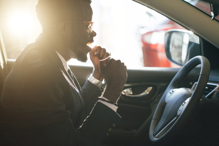 Stylish black man in carの写真素材