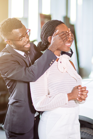 black Man Giving Surprise To Wife By Purchasing New Carの写真素材