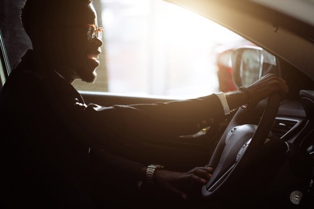 Stylish black man in carの写真素材