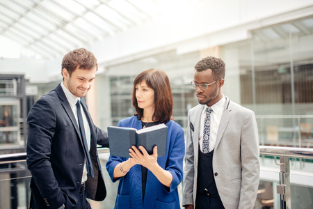 multinational, business team having discussion on note in officeの写真素材