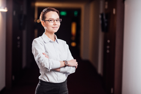 businesswoman standing in office buildingの写真素材
