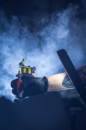 tattoo machine with smokeの写真素材