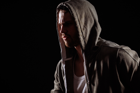 side view image of thoughtful murder on the black backgroundの写真素材