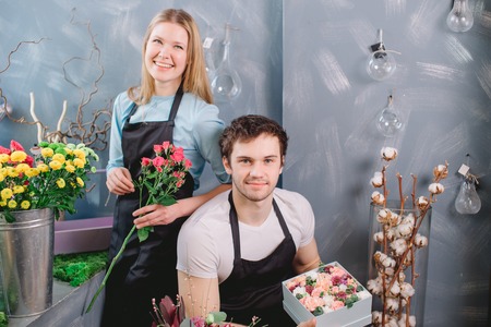 two florists doing flower business togetherの写真素材