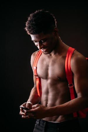 closeup portrait of African guy downloading music.の写真素材