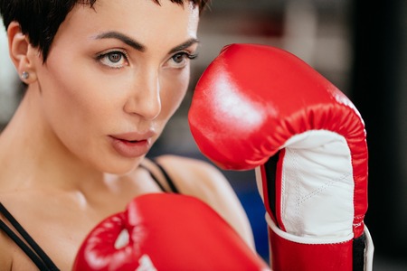 closeup cropped photo of woman going in for kickboxingの写真素材