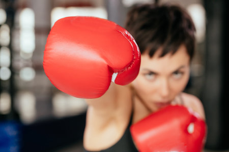 blured shot of red gloves. attack the photographer