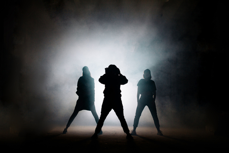 portrait of singer with her dancers on the black backgroundの写真素材