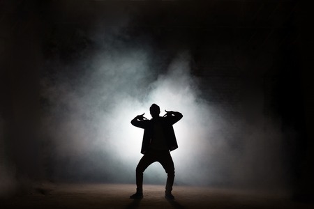 rapper dancing isolated on black backgroundの写真素材